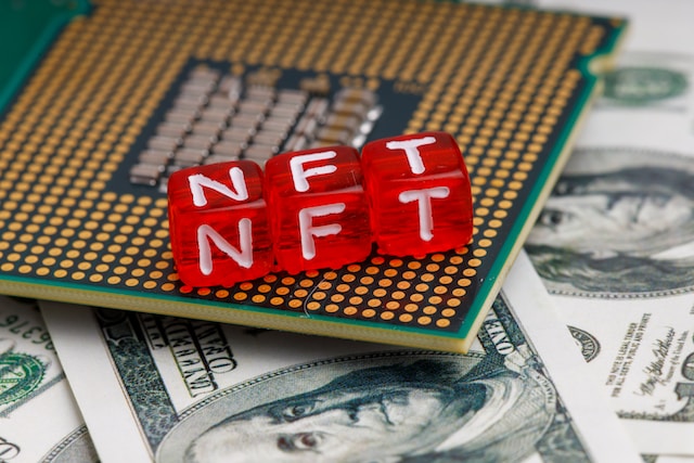 NFT on top of a processor chip and dollar bills